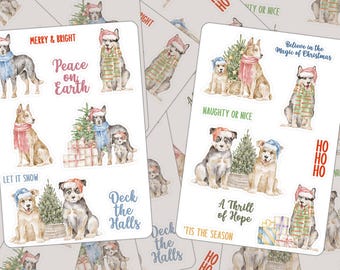 May include: Two sticker sheets featuring watercolor illustrations of dogs wearing winter scarves and hats, Christmas trees, and gifts. Text includes MERRY & BRIGHT, Peace on Earth, LET IT SNOW, Deck the Halls, Believe in the Magic of Christmas, NAUGHTY OR NICE, A Thrill of Hope, and 'TIS THE SEASON.