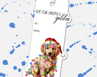 May include: A Christmas gift tag featuring a golden retriever puppy wearing a Santa hat and Christmas lights. The tag says "Hope your Christmas is golden." with space for "To:" and "From:"