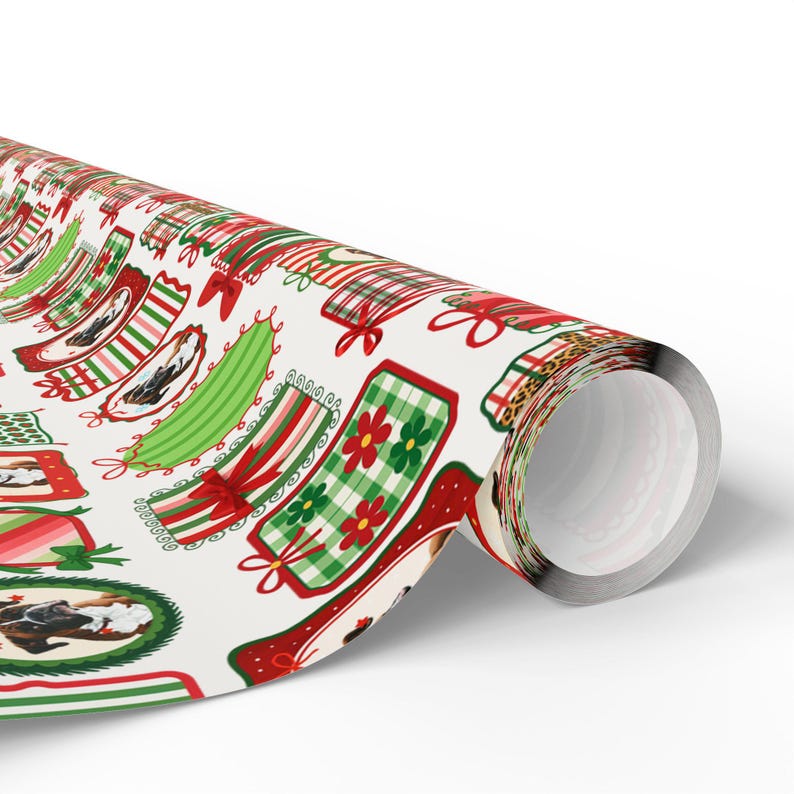 A roll of wrapping paper with a repeating pattern of Christmas-themed designs, including various shapes, patterns, and colors such as red, green, and white.