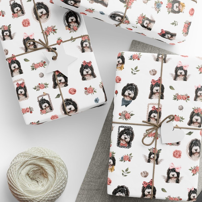 a table topped with wrapping paper and scissors