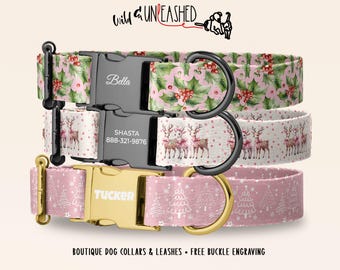 May include: Three dog collars with holiday patterns. The top collar has holly and berries with a black buckle engraved with Bella. The middle collar features reindeer with a black buckle engraved with Shasta and 888-321-9876. The bottom collar has white trees on pink with a gold buckle engraved with Tucker.