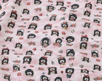 May include: Pink fabric with a repeating pattern of black and white dog portraits, some with bows, floral wreaths, and framed portraits. The design includes small floral accents and is suitable for various craft projects.