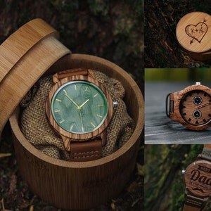 May include: Three wooden wristwatches with different designs. The first watch has a green face and a brown wooden band. The second watch has a brown face with a black and brown band. The third watch has a brown face with a brown band and the text "Best Dad in the World" engraved on the face.