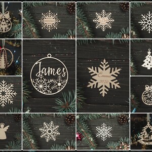 May include: Assortment of laser cut wooden Christmas ornaments in various shapes and designs, including snowflakes, trees, a bell, and a star. Some ornaments feature personalized names and dates, such as "James" and "Emma 2020".