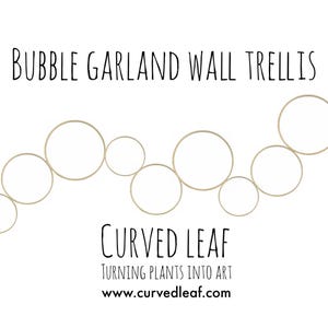 May include: A bubble garland wall trellis with a series of interconnected, light-colored circular frames. The text "Bubble Garland Wall Trellis" and "Curved Leaf" are displayed above and below the design, respectively. The website www.curvedleaf.com is also visible.