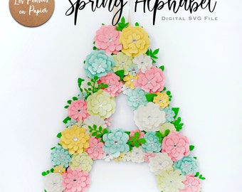 May include: A floral letter "A" made of pastel-colored flowers, including pink, yellow, and blue, with green leaves. The text "Spring Alphabet" and "DIGITAL SVG FILE" are displayed. The design is intended for cutting machines and DIY projects.