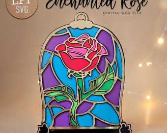 May include: A stained glass style Enchanted Rose in a glass dome, with a gold frame and a black base. The rose is red with pink accents and green leaves. The text "LPP SVG" and "DIGITAL SVG FILE" is visible in the image. The text "DESIGNED FOR CUTTING MACHINES AND DIY PROJECTS" and "N°4" is also visible in the image.