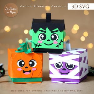 Könnte beinhalten: Drei Papierboxen mit Halloween-Figuren: ein grünes Frankenstein-Monster, ein orangefarbener Kürbis und eine violette Mumie, die mit weißen Streifen umwickelt ist. Jede Box hat große Augen, rosa Wangen und einen lächelnden Mund. Text: 3D SVG.