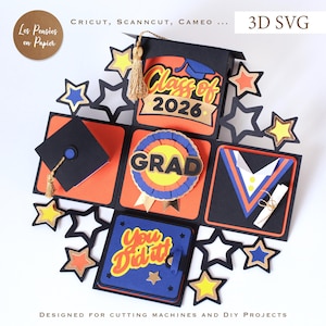 May include: A 3D paper craft graduation explosion box featuring black, orange, blue, and yellow cardstock. The box displays text reading Class of 2026, GRAD, and You Did It, accented with a gold tassel, star cutouts, and a miniature diploma.