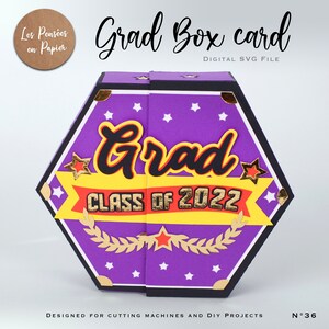 May include: A purple hexagonal box card with a gold and red ribbon that says "Class of 2022". The box card has a black border and is decorated with white stars and gold accents. The text "Grad Box Card" is at the top of the image. The text "Digital SVG File" is below the title. The text "Designed for Cutting Machines and DIY Projects" is at the bottom of the image. The text "N&deg;36" is in the bottom right corner of the image.