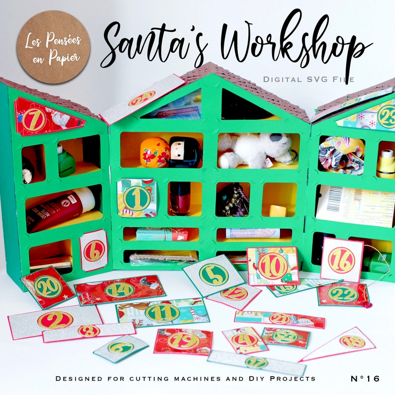 May include: A green and brown papercraft advent calendar shaped like a house with 25 numbered doors. The doors are decorated with gold glitter and red and gold paper. The calendar is designed for cutting machines and DIY projects. The text "Santa's Workshop" is written in white on a red background at the top of the image. The text "Digital SVG File" is written in white on a black background below the title. The text "Les Pens&eacute;es en Papier" is written in white on a brown circle at the top left of the image. The text "N&deg;16" is written in black on a white background at the bottom right of the image.