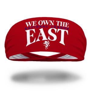May include: Red headband with white text that reads "We Own The National League East".