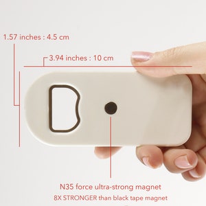 May include: White plastic bottle opener with a built-in N35 magnet. The magnet is 8 times stronger than a black tape magnet. The bottle opener measures 3.94 inches by 1.57 inches.