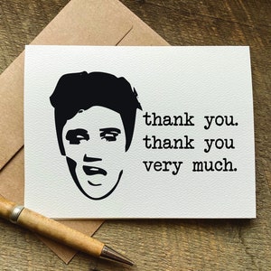 May include: A white card with a black and white silhouette of Elvis Presley's face. The text "thank you. thank you very much." is printed below the image.