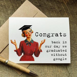 May include: A graduation greeting card with a vintage illustration of a woman wearing a graduation cap. The card reads "Congrats back in our day we graduated without google". A pen and envelope are also in the image.
