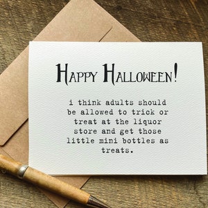 A funny white halloween greeting card with black text that reads 'HAPPY HALLOWEEN!' and 'i think adults should be allowed to trick or treat at the liquor store and get those little mini bottles as treats.'