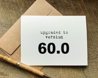 Peut inclure: Une carte blanche avec du texte noir qui dit "upgraded to version 60.0".