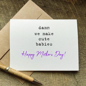 May include: A white ceramic mug with a black handle and the text "But First, Coffee" in a black, bold font. The mug is sitting on a wooden surface. The mug is 4 inches tall.