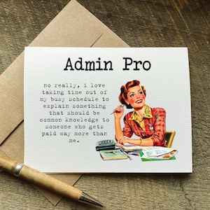 May include: A greeting card with the text "Admin Pro" and a vintage illustration of a woman at a desk. The card includes text about explaining common knowledge. A pen and envelope are also visible.
