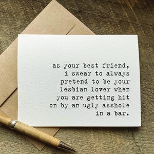 May include: A white greeting card with black typewriter-style text that reads: as your best friend, i swear to always pretend to be your lesbian lover when you are getting hit on by an ugly asshole in a bar. The card is paired with a brown envelope.