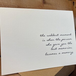May include: A white card with black text that reads: "the saddest moment is when the person who gave you the best memories, becomes a memory."