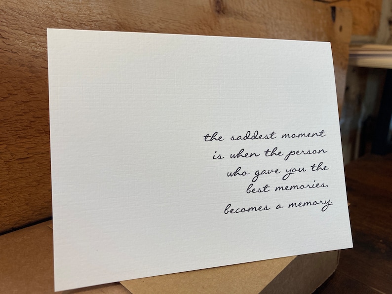 May include: A white card with black text that reads: "the saddest moment is when the person who gave you the best memories, becomes a memory."
