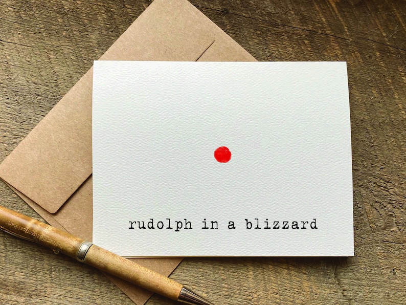 A funny Christmas card with a red dot in the center and the text 'rudolph in a blizzard'