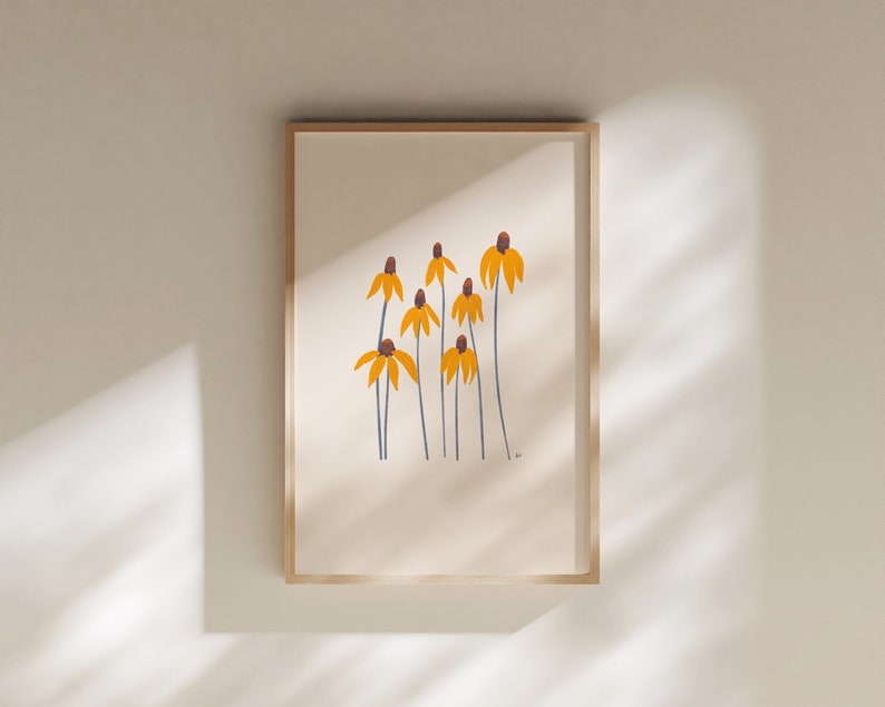 May include: A framed print of a minimalist illustration of yellow flowers with brown centers and blue stems on a cream background.