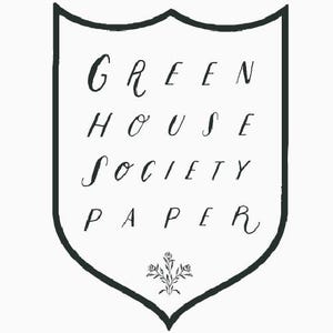 May include: A black and white illustration of a shield with the text "GREEN HOUSE SOCIETY PAPER" inside. The shield has a small floral design at the bottom.