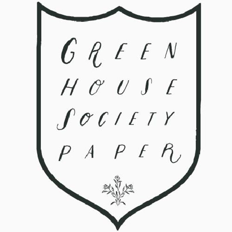 May include: A black and white illustration of a shield with the text "GREEN HOUSE SOCIETY PAPER" inside. The shield has a small floral design at the bottom.