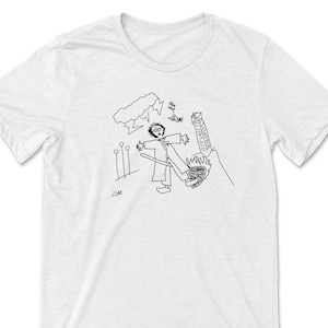 May include: A black and white line drawing of a person with outstretched arms standing in front of a tall, thin object. The person is wearing a long robe and has a stick in their hand. There are three small circles in the background, and a cloud with lightning bolts above the person's head. The drawing is on a white t-shirt.