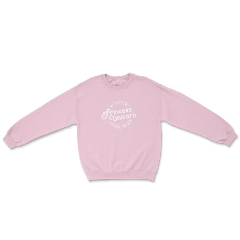 May include: A light pink sweatshirt with a white circular graphic that says "My horn can pierce the sky" and "Princess Unicorn".