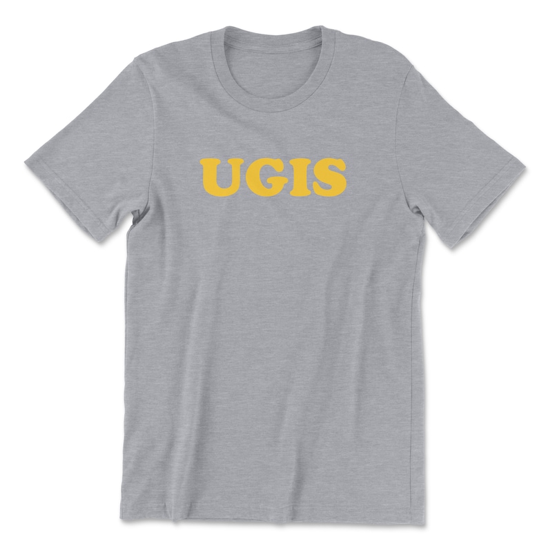 May include: A heather grey t-shirt with the word "UGIS" printed in yellow.