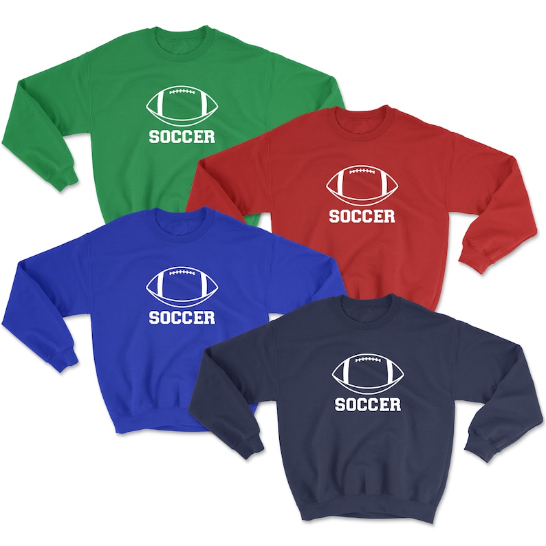 May include: Four crewneck sweatshirts in green, red, blue, and navy. Each sweatshirt features a white football graphic above the word "SOCCER". The sweatshirts are made of a soft material.