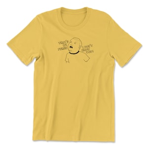 May include: A yellow t-shirt with a black and white cartoon image of a person saying "That's my purse! I don't know you!"