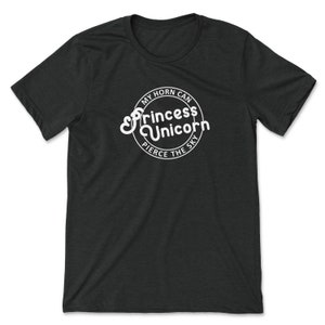 May include: Black t-shirt with a white circle graphic that says "My horn can pierce the sky" with the words "Princess Unicorn" in a stylized font.