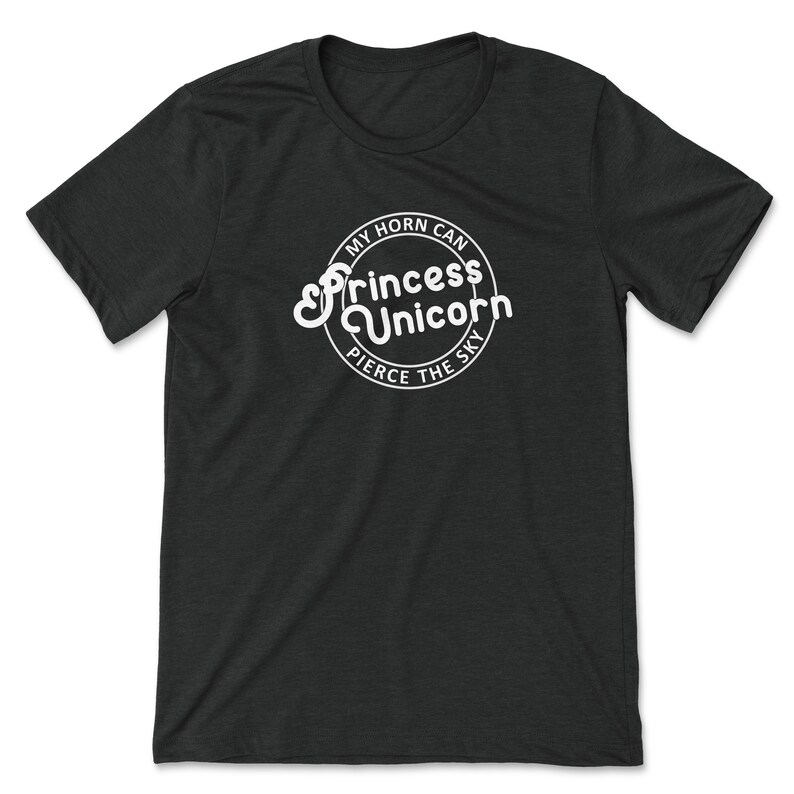 May include: Black t-shirt with a white circle graphic that says "My horn can pierce the sky" with the words "Princess Unicorn" in a stylized font.