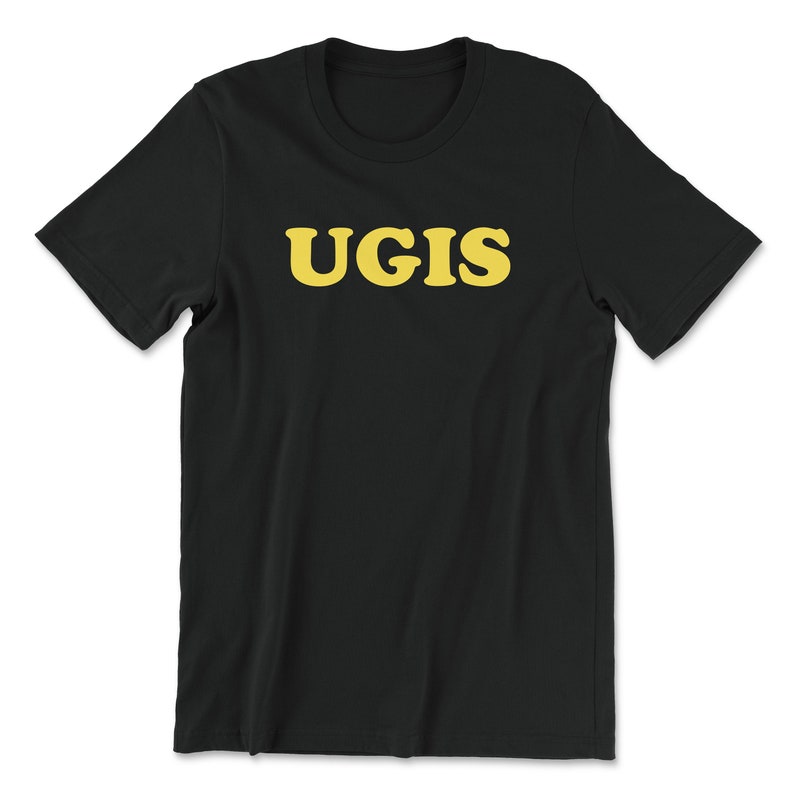 May include: Black t-shirt with the word "UGIS" printed in yellow.