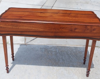 Solid mahogany Pembroke table with two full drawers, federal style inlay and carving