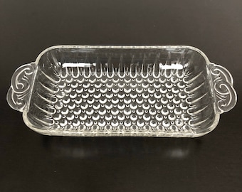 Plato para servir de vidrio transparente rectangular brillante y transparente con asas de volutas y base de clavos