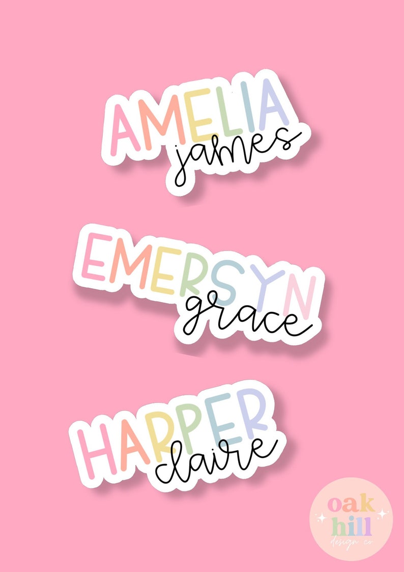 May include: Three stickers with names in pastel colors on a pink background. The names are Amelia James, Emersyn Grace, and Harper Claire, each with a white outline and a handwritten font. The Oak Hill Design Co. logo is in the bottom right corner.