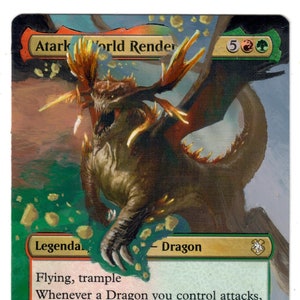 May include: A green and brown fantasy art card with a dragon illustration. The card is titled "Atark World Render" and has a mana cost of 5 green and 2 red. The card text reads "Flying, trample. Whenever a Dragon you control attacks, it gains double strike until end of turn. "Her hunger knows no limit. Left unchecked, she would feast on all of Tarkir." -Yasova Dragonclaw". The card is a 6/4 creature.