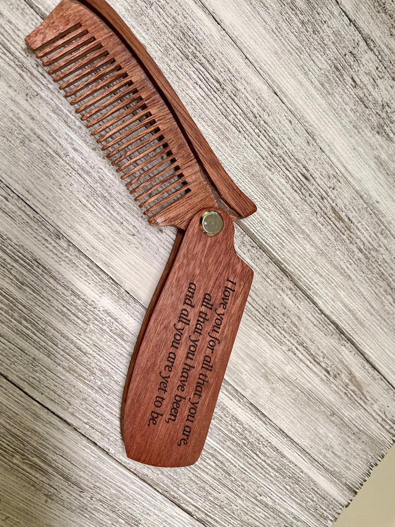 May include: A wooden comb with a folding handle. The handle has an engraved message: "I love you for all that you are, all that you have been, and all you are yet to be."