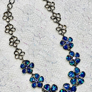 Sterling iolite & opal flower gemstone bracelet. Inlaid opal-prong set iolite. 8 inhes long with adjustable length. Marked 925. Gift.
