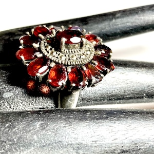 Large Antique Victorian to Edwardian red wine almandine garnet ring with faceted cut ovals.