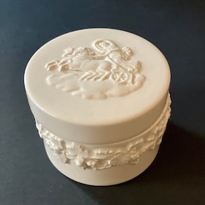 Antique wedgwood embossed queensware ceramic container with a chariot rider from England. Trinket or ring box.