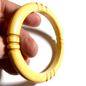 Bakelite carved butterscotch bangle bracelet. Era early 1900’s. Tests positive with simethicone. Gift for her.