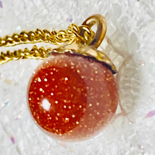 Art Deco goldstone pendant necklace. Dainty pendant necklace. Hallmarked 12k gold filled. With 18” gold filled chain.