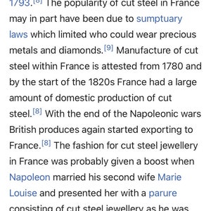 May include: A text excerpt from a book about the history of cut steel jewelry in France. The text mentions the popularity of cut steel jewelry in France, sumptuary laws, and the role of Napoleon in promoting the fashion.