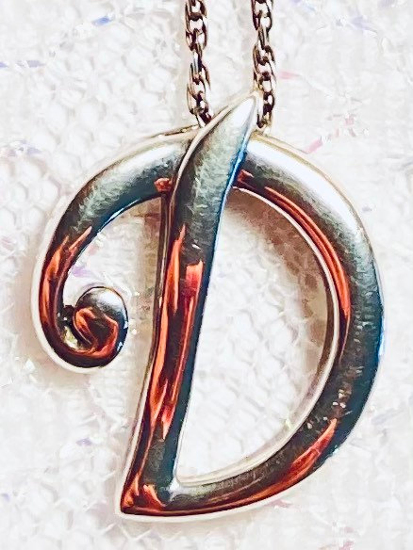 Sterling silver, letter D pendant necklace. Both marked 925. Circa